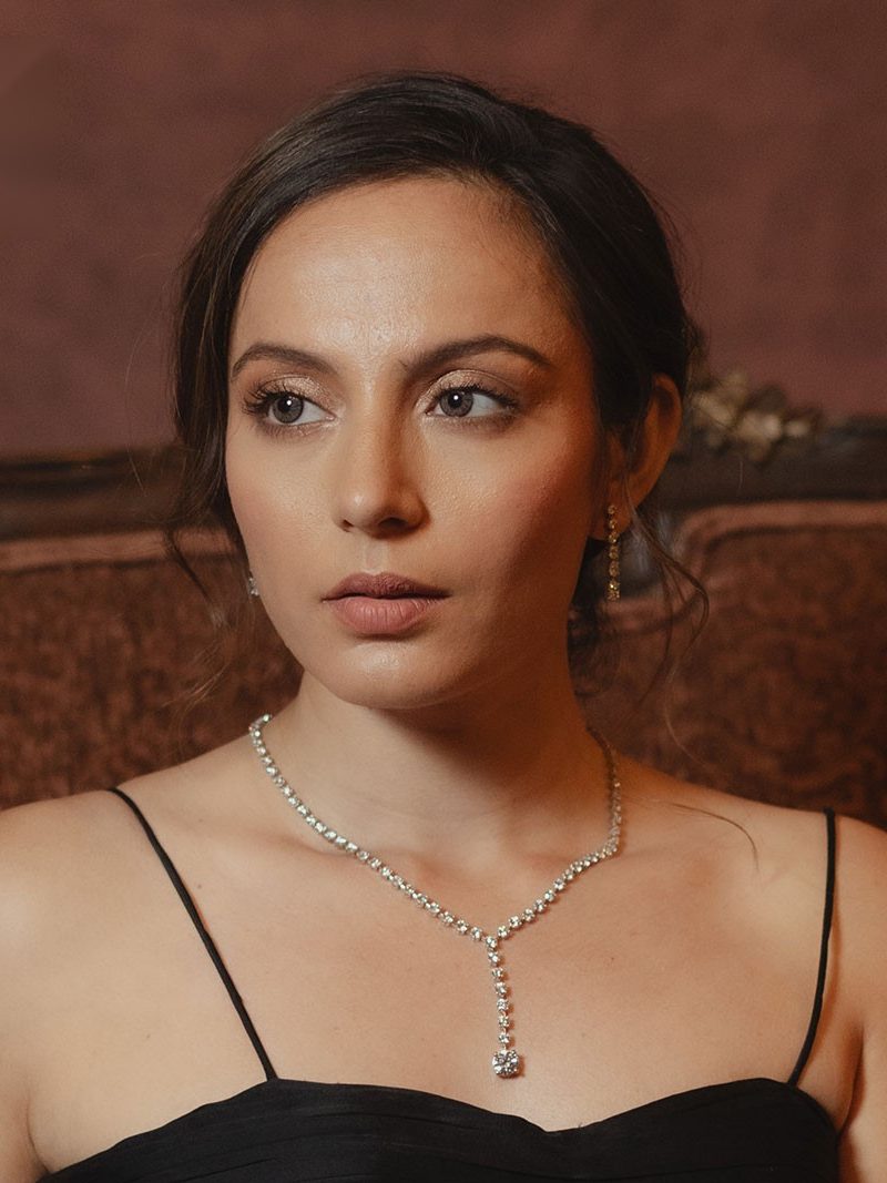 Model wearing a fine diamond pendant necklace