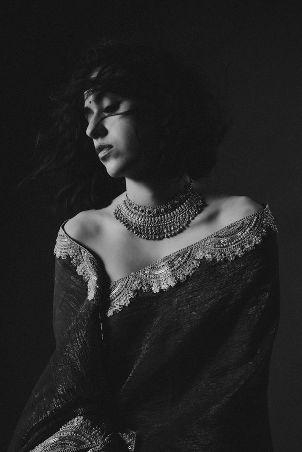 Monochrome portrait with a statement gold choker